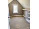 Walk-in closet featuring custom shelving, rod and natural light from the window at 140 Hunters Hill Dr, Statesville, NC 28677