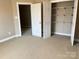 Walk-in closet features rods, shelving, and plenty of storage space with access to bedroom at 140 Hunters Hill Dr, Statesville, NC 28677