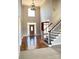 Grand foyer featuring hardwood floors, a staircase, and an abundance of natural light at 140 Hunters Hill Dr, Statesville, NC 28677