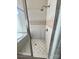 Tiled shower featuring glass door and neutral tones at 140 Hunters Hill Dr, Statesville, NC 28677