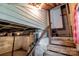 Unfinished basement stairs with open ceilings, block foundation, and electrical box at 1406 Upper Enochville Rd, Kannapolis, NC 28081