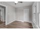 Bedroom with neutral paint, wood floors and a doorway to another room at 1406 Upper Enochville Rd, Kannapolis, NC 28081