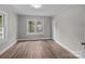 Bedroom with neutral paint, wood floor and double windows at 1406 Upper Enochville Rd, Kannapolis, NC 28081