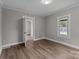 This is a bedroom with neutral paint, laminate flooring and a window at 1406 Upper Enochville Rd, Kannapolis, NC 28081