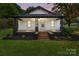 Charming home featuring a cozy front porch with updated landscaping at 1406 Upper Enochville Rd, Kannapolis, NC 28081