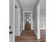 Hallway with wood floors leading to various rooms in the house at 1406 Upper Enochville Rd, Kannapolis, NC 28081