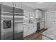 Updated kitchen featuring stainless steel appliances, white cabinetry, and granite countertops at 1406 Upper Enochville Rd, Kannapolis, NC 28081