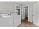Functional laundry room with washer, dryer, and access to other rooms, offering convenience and practicality at 1406 Upper Enochville Rd, Kannapolis, NC 28081