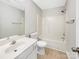 Bright bathroom features a modern vanity, toilet, and shower-tub combination at 14123 Tranters Creek Ln, Charlotte, NC 28273
