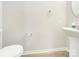 Powder room featuring a modern sink and toilet at 14123 Tranters Creek Ln, Charlotte, NC 28273