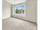 Bright bedroom featuring a large window offering ample natural light at 14123 Tranters Creek Ln, Charlotte, NC 28273