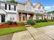 Charming townhouse showcasing well-manicured lawn and inviting front porch at 14123 Tranters Creek Ln, Charlotte, NC 28273