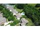 Aerial view showcasing a home, the neighborhood and the proximity to lush greenery and other houses at 14700 Old Vermillion Dr, Huntersville, NC 28078