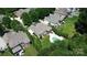 Aerial view of a neighborhood home featuring a spacious yard with a lush lawn and a swimming pool at 14700 Old Vermillion Dr, Huntersville, NC 28078