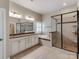 Large primary bathroom with separate shower and tub and a double sink vanity at 14700 Old Vermillion Dr, Huntersville, NC 28078