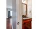 Stylish bathroom with a beautiful vanity and a view into another room at 14700 Old Vermillion Dr, Huntersville, NC 28078