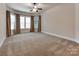 Bright and spacious primary bedroom with bay windows and custom draperies at 14700 Old Vermillion Dr, Huntersville, NC 28078