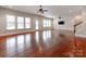 Expansive living room featuring hardwood floors, abundant natural light, and seamless indoor-outdoor flow at 14700 Old Vermillion Dr, Huntersville, NC 28078