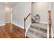 Stairway with chair lift for easy access and beautiful wood and carpet design at 14700 Old Vermillion Dr, Huntersville, NC 28078