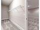 An organized walk-in closet features a wire shelving system and patterned carpeting at 14700 Old Vermillion Dr, Huntersville, NC 28078