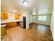 Bright and airy kitchen adjoining the living area, complete with modern appliances and ample counter space at 1583 Green Circle Dr, Gastonia, NC 28054