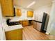 Functional kitchen featuring modern appliances, granite countertops, and ample storage space at 1583 Green Circle Dr, Gastonia, NC 28054