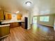 Open-concept kitchen and living area featuring modern appliances and stylish flooring at 1583 Green Circle Dr, Gastonia, NC 28054