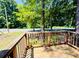 Relaxing wooden porch with classic railing, offering a serene neighborhood panorama at 1583 Green Circle Dr, Gastonia, NC 28054