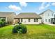 Wide backyard features well maintained lawn, patio, and neighboring houses at 16213 Kelby Cv, Charlotte, NC 28278