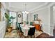 Formal dining room with wainscoting, designer rug, and buffet at 16213 Kelby Cv, Charlotte, NC 28278