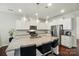 Eat-in kitchen features granite countertops, an island, and stainless steel appliances at 16213 Kelby Cv, Charlotte, NC 28278