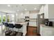 Eat-in kitchen features granite countertops, an island, and stainless steel appliances at 16213 Kelby Cv, Charlotte, NC 28278