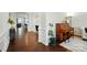 Elegant hardwood floors lead into living spaces, complemented by detailed trim and neutral decor at 16213 Kelby Cv, Charlotte, NC 28278