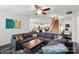Spacious living room showcases a fireplace, hardwood floors, large sofa, and staircase access at 16213 Kelby Cv, Charlotte, NC 28278