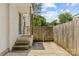 Charming brick patio entrance with wooden gate and a white brick exterior at 1713 Shamrock Dr, Charlotte, NC 28205