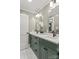 Modern bathroom with double vanity, quartz countertop, and stylish lighting at 1713 Shamrock Dr, Charlotte, NC 28205