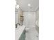 Modern bathroom with hexagon tile floor, shower, and shelving at 1713 Shamrock Dr, Charlotte, NC 28205