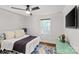 Comfortable bedroom with ceiling fan, hardwood floors, and plenty of natural light at 1713 Shamrock Dr, Charlotte, NC 28205