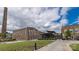 Optimist Hall with well-manicured landscaping offers a blend of brick and modern architecture at 1713 Shamrock Dr, Charlotte, NC 28205