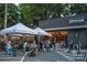 The Artisan's Palate offers a cozy outdoor dining space with covered seating at 1713 Shamrock Dr, Charlotte, NC 28205