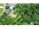 Aerial view of property showcasing the house and surrounding trees with estimated property outline at 1819 Brompton Ct, Newton, NC 28658