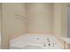 Clean, well-maintained bathtub with a tile surround in a neutrally decorated bathroom at 1819 Brompton Ct, Newton, NC 28658