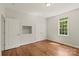 Bedroom features hardwood floors, built-in nook, closet with double doors, and natural light from window at 1819 Brompton Ct, Newton, NC 28658