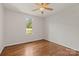 Bedroom with hardwood floors, a ceiling fan, and a window providing plenty of natural light at 1819 Brompton Ct, Newton, NC 28658