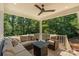 Inviting covered porch with comfortable seating and a serene view of the lush backyard at 1819 Brompton Ct, Newton, NC 28658
