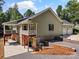 Beautiful home exterior featuring a back porch, garage, and well-maintained landscaping at 1819 Brompton Ct, Newton, NC 28658