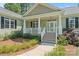 Charming home with a covered front porch, manicured landscaping, and welcoming entrance at 1819 Brompton Ct, Newton, NC 28658