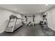 Well-equipped home gym with a treadmill, weight rack, stationary bike, and elliptical machine at 1819 Brompton Ct, Newton, NC 28658