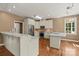 Stylish kitchen with white cabinets, stainless steel appliances, granite countertops, and hardwood floors at 1819 Brompton Ct, Newton, NC 28658