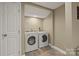 Laundry room featuring a washer and dryer, tile floors, and white door and trim at 1819 Brompton Ct, Newton, NC 28658